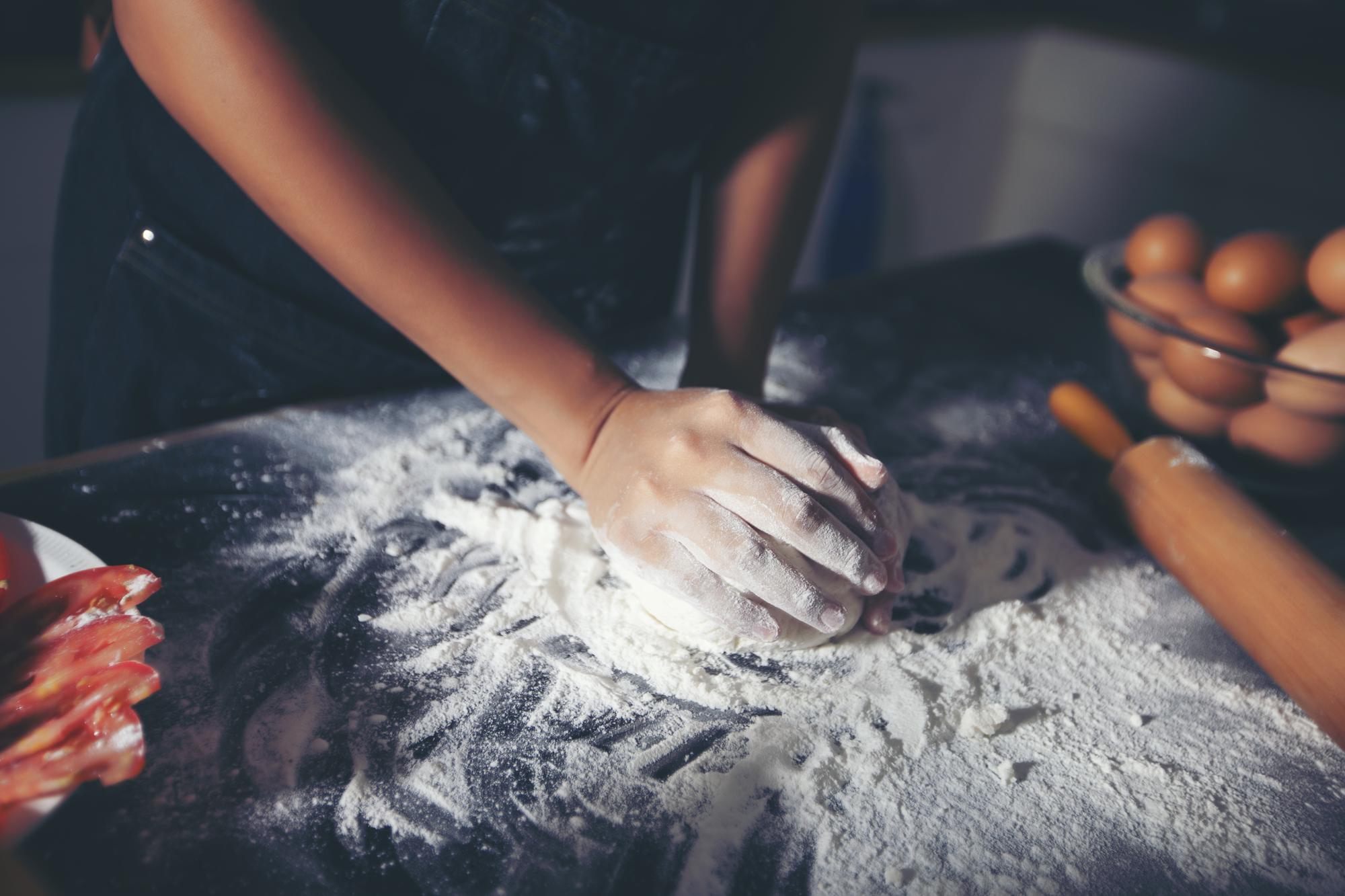 Hands-on dough shaping during a pastry segment